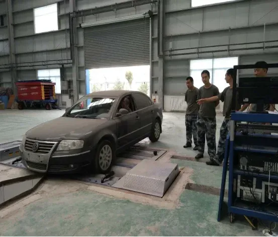 Military personnel inspecting a vehicle on the field inspection line.
